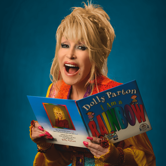 dolly parton holding a book